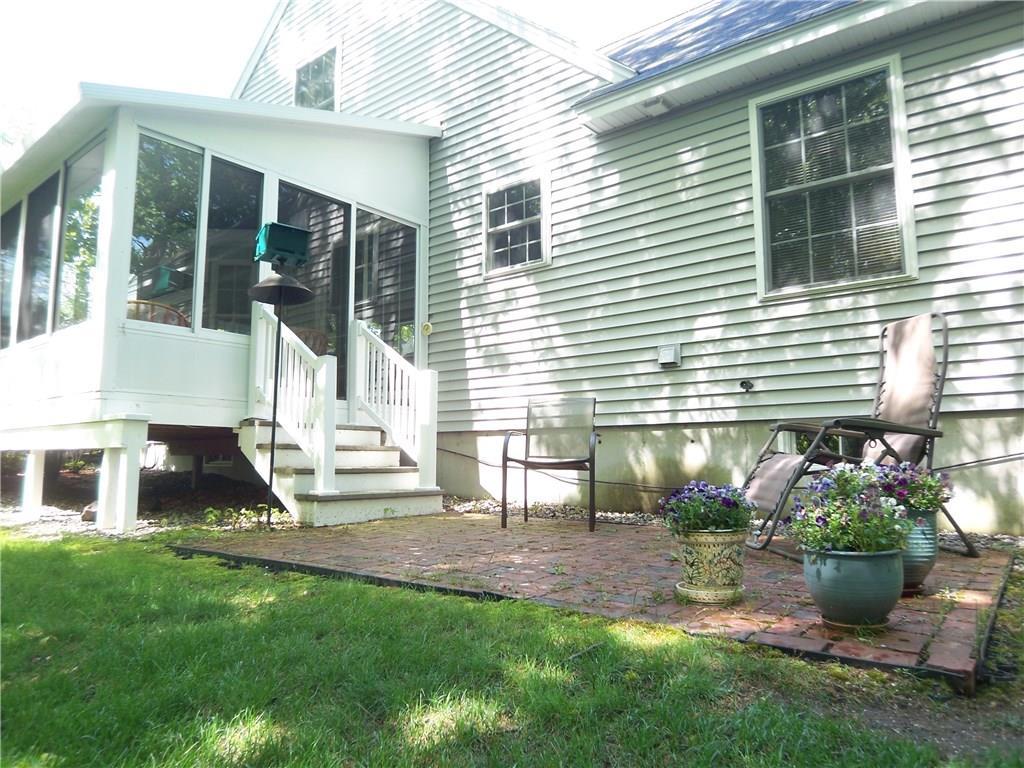 9 Captains Walk, Unit 17 Wells, ME 04090 - Photo 18 of 18 The side yard features a patio just...