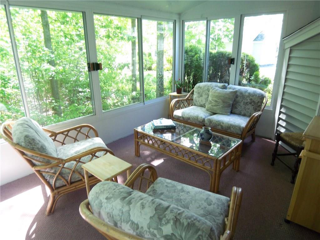 9 Captains Walk, Unit 17 Wells, ME 04090 - Photo 8 of 18 A glassed in porch allows you to...