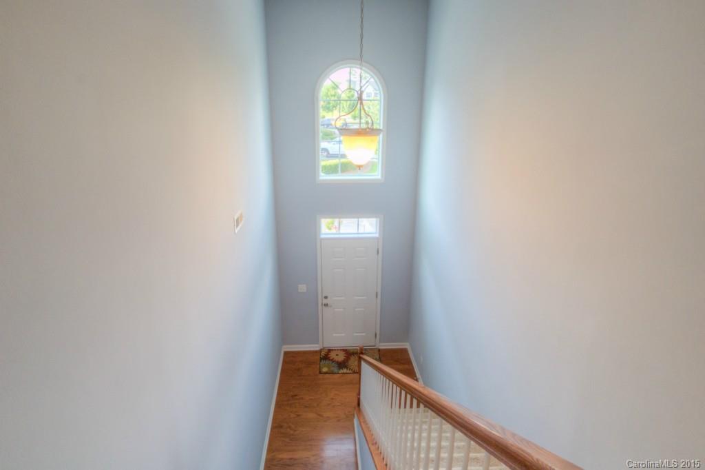 211 Chartwell Lane, Unit 211 Tega Cay, SC 29708 - Photo 2 of 19 a view of a hallway with window