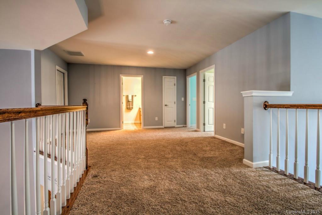 211 Chartwell Lane, Unit 211 Tega Cay, SC 29708 - Photo 13 of 19 a view of empty room with wooden floor