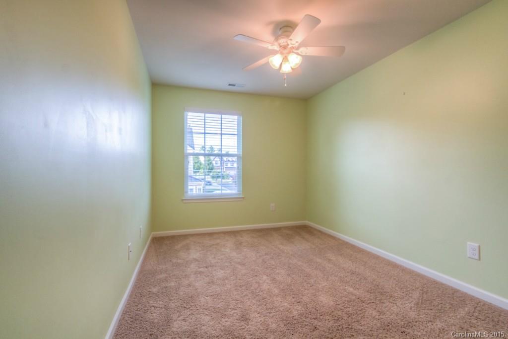 211 Chartwell Lane, Unit 211 Tega Cay, SC 29708 - Photo 14 of 19 an empty room with a window
