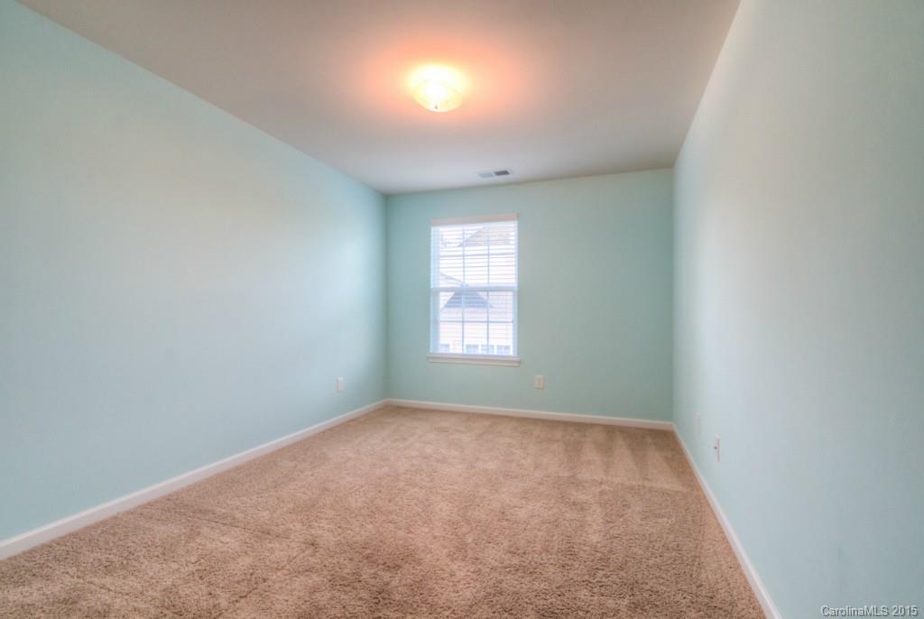 211 Chartwell Lane, Unit 211 Tega Cay, SC 29708 - Photo 15 of 19 an empty room with a window