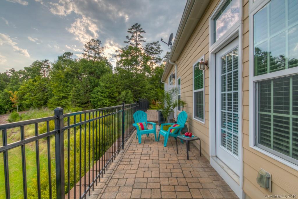 211 Chartwell Lane, Unit 211 Tega Cay, SC 29708 - Photo 18 of 19 a view of a balcony with furniture