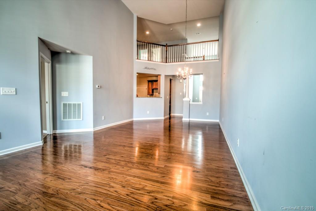 211 Chartwell Lane, Unit 211 Tega Cay, SC 29708 - Photo 8 of 19 a view of interior space with wooden floor and kitchen