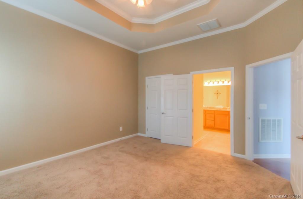 211 Chartwell Lane, Unit 211 Tega Cay, SC 29708 - Photo 9 of 19 a view of an empty room and a window