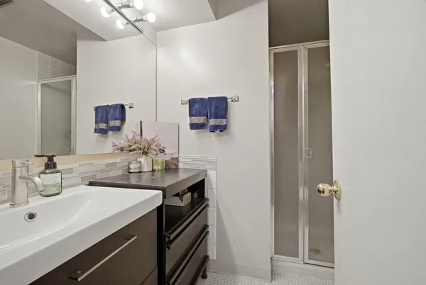 a bathroom with a sink and a mirror