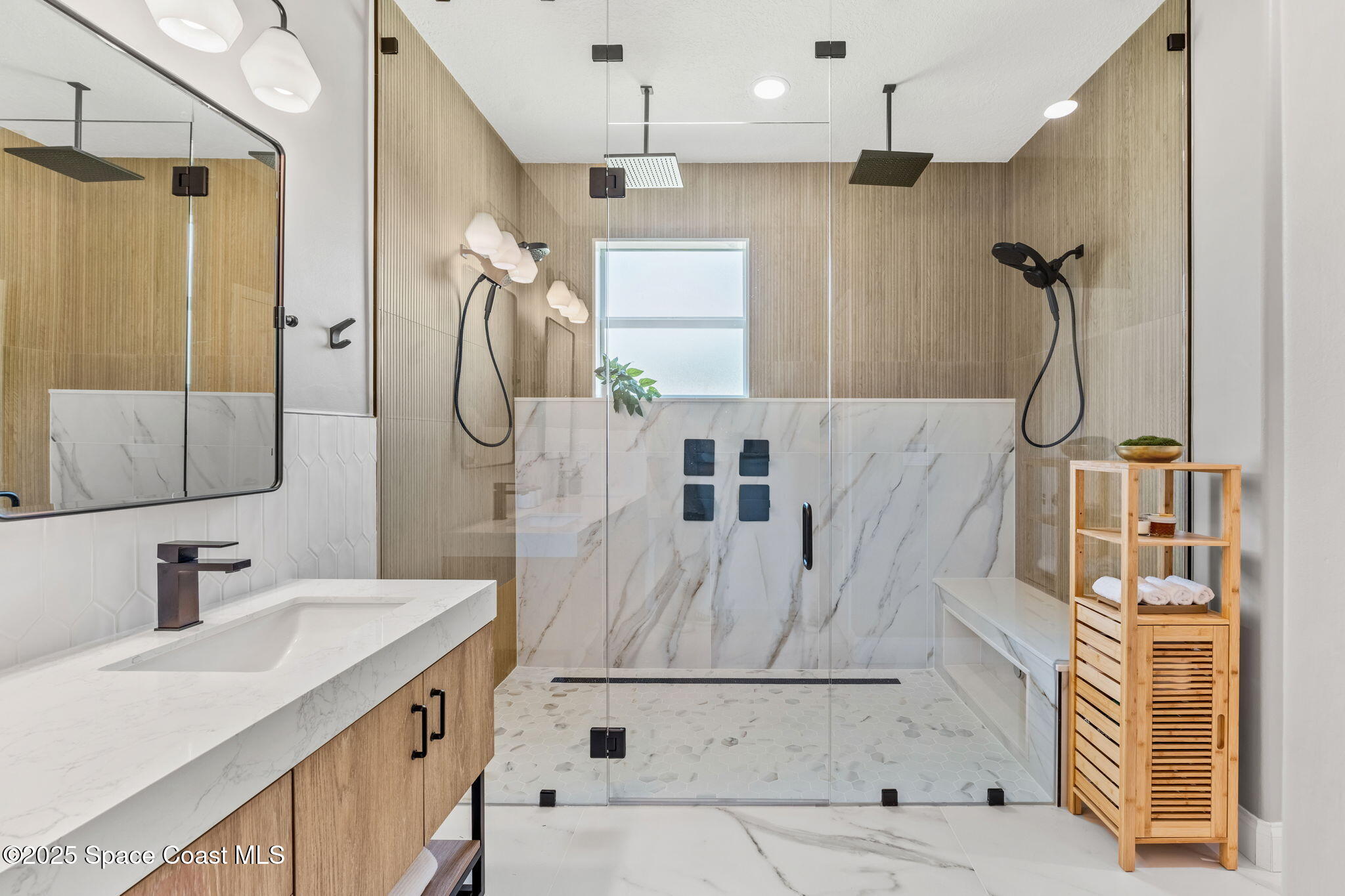 5824 Trieda Drive Melbourne, FL 32940 - Photo 12 of 45 a bathroom with a sink vanity and shower