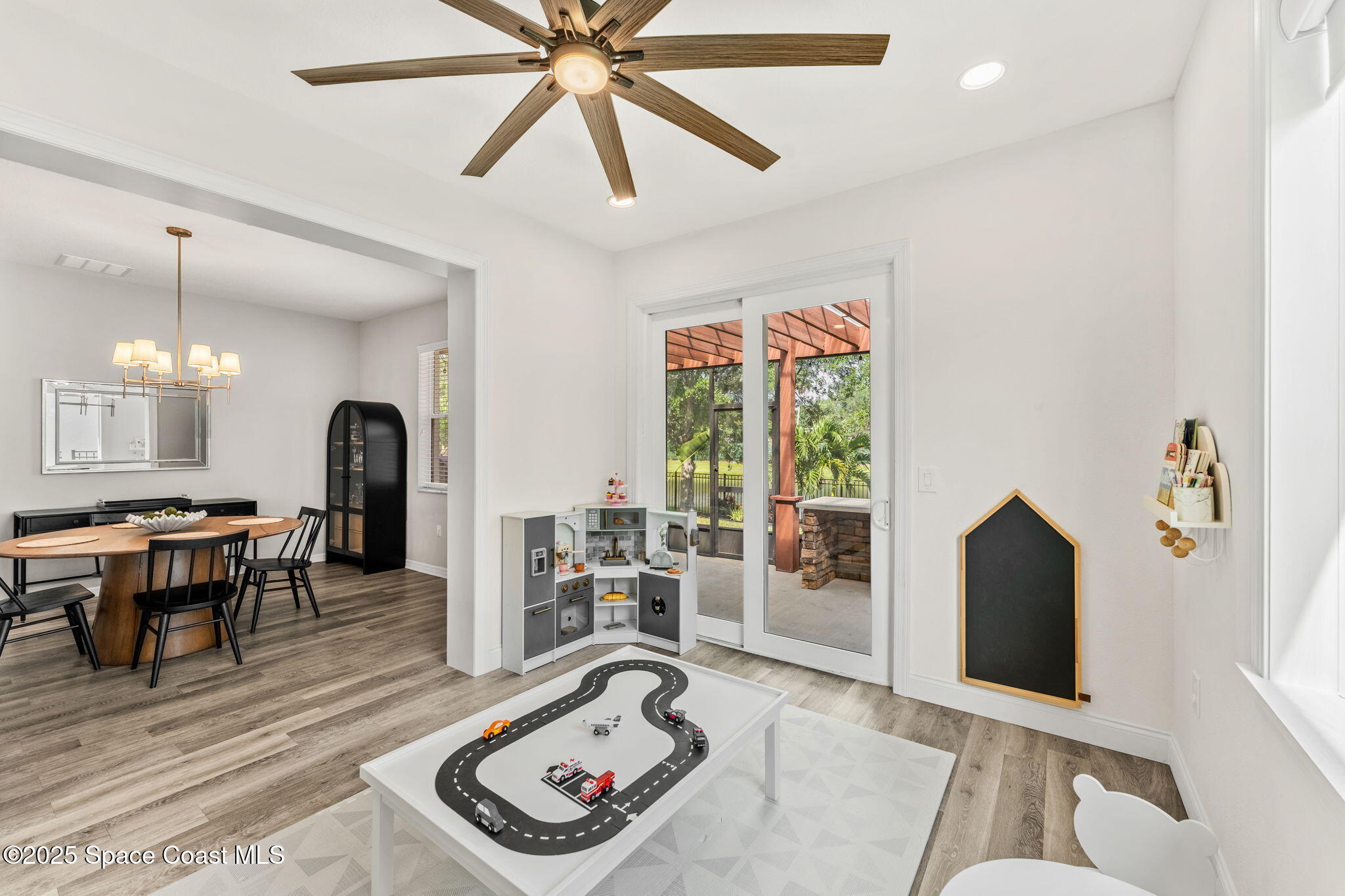 5824 Trieda Drive Melbourne, FL 32940 - Photo 17 of 45 a living room with furniture and a wooden floor