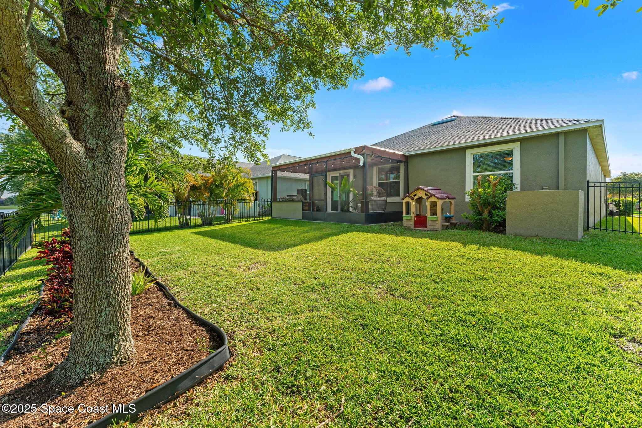 5824 Trieda Drive Melbourne, FL 32940 - Photo 31 of 45 a view of a house with backyard and sitting area