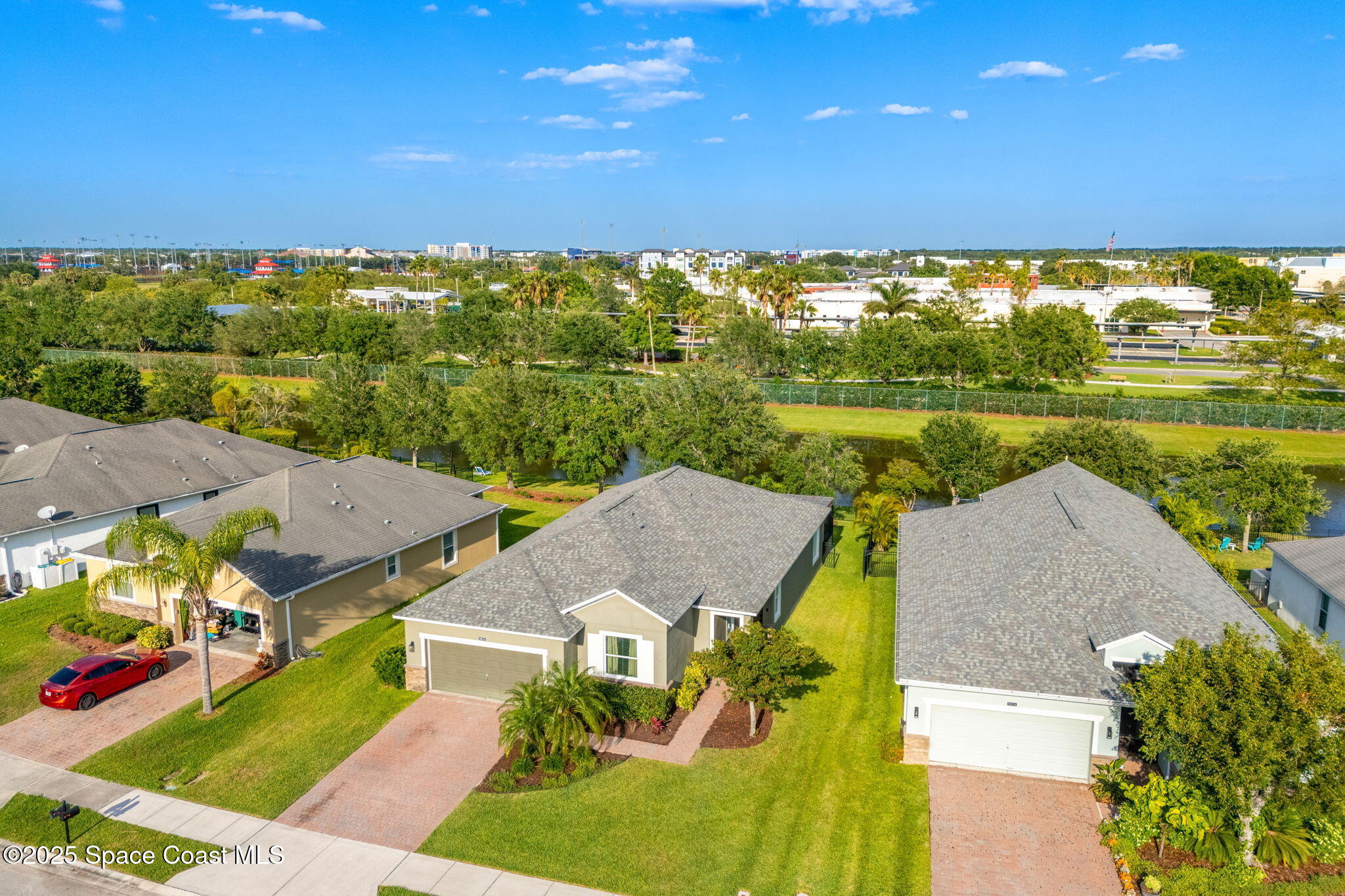 5824 Trieda Drive Melbourne, FL 32940 - Photo 33 of 45 an aerial view of residential houses with outdoor space and ocean view