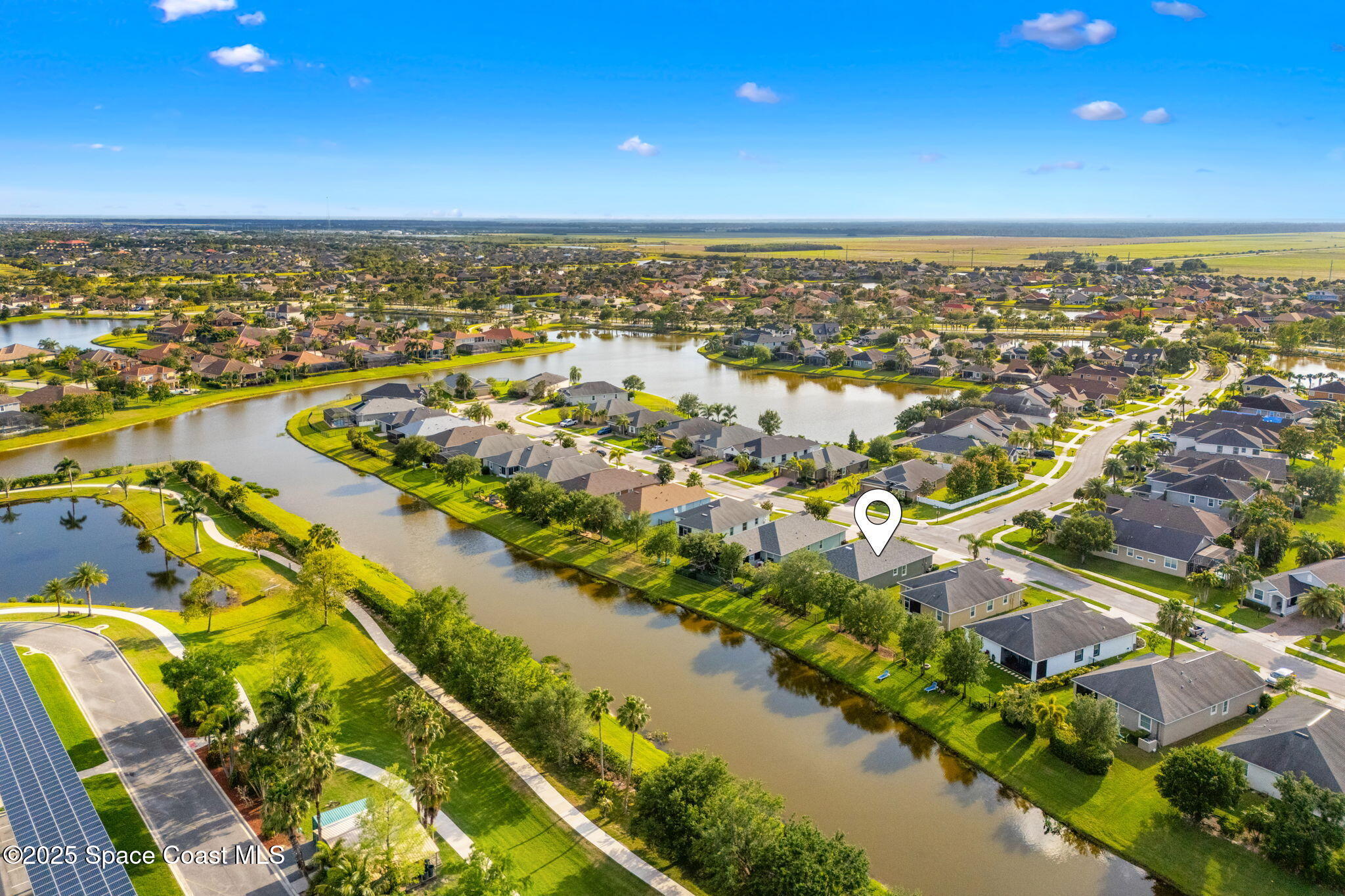 5824 Trieda Drive Melbourne, FL 32940 - Photo 36 of 45 an aerial view of residential building and lake