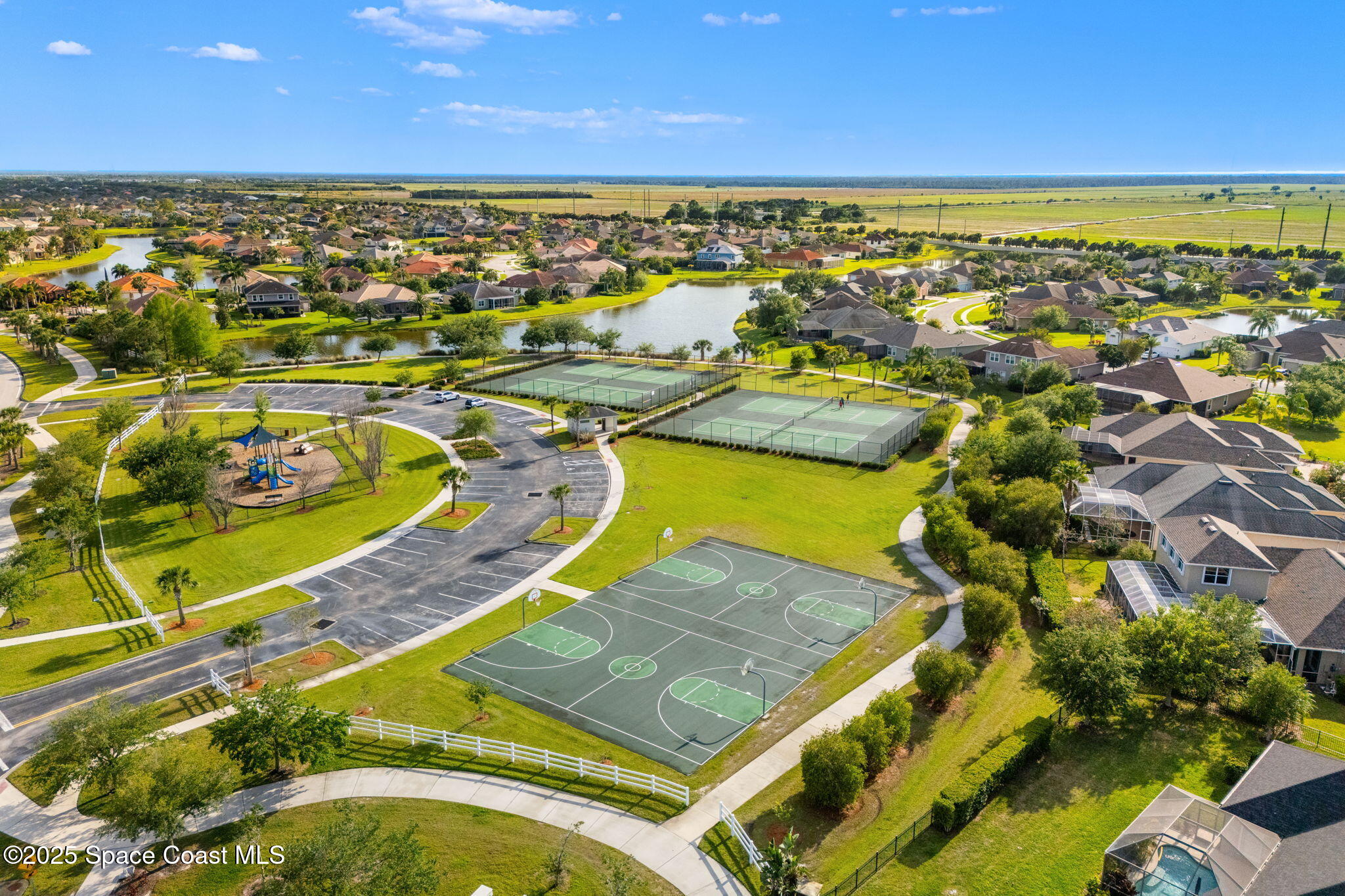 5824 Trieda Drive Melbourne, FL 32940 - Photo 41 of 45 an aerial view of a pool with outdoor seating