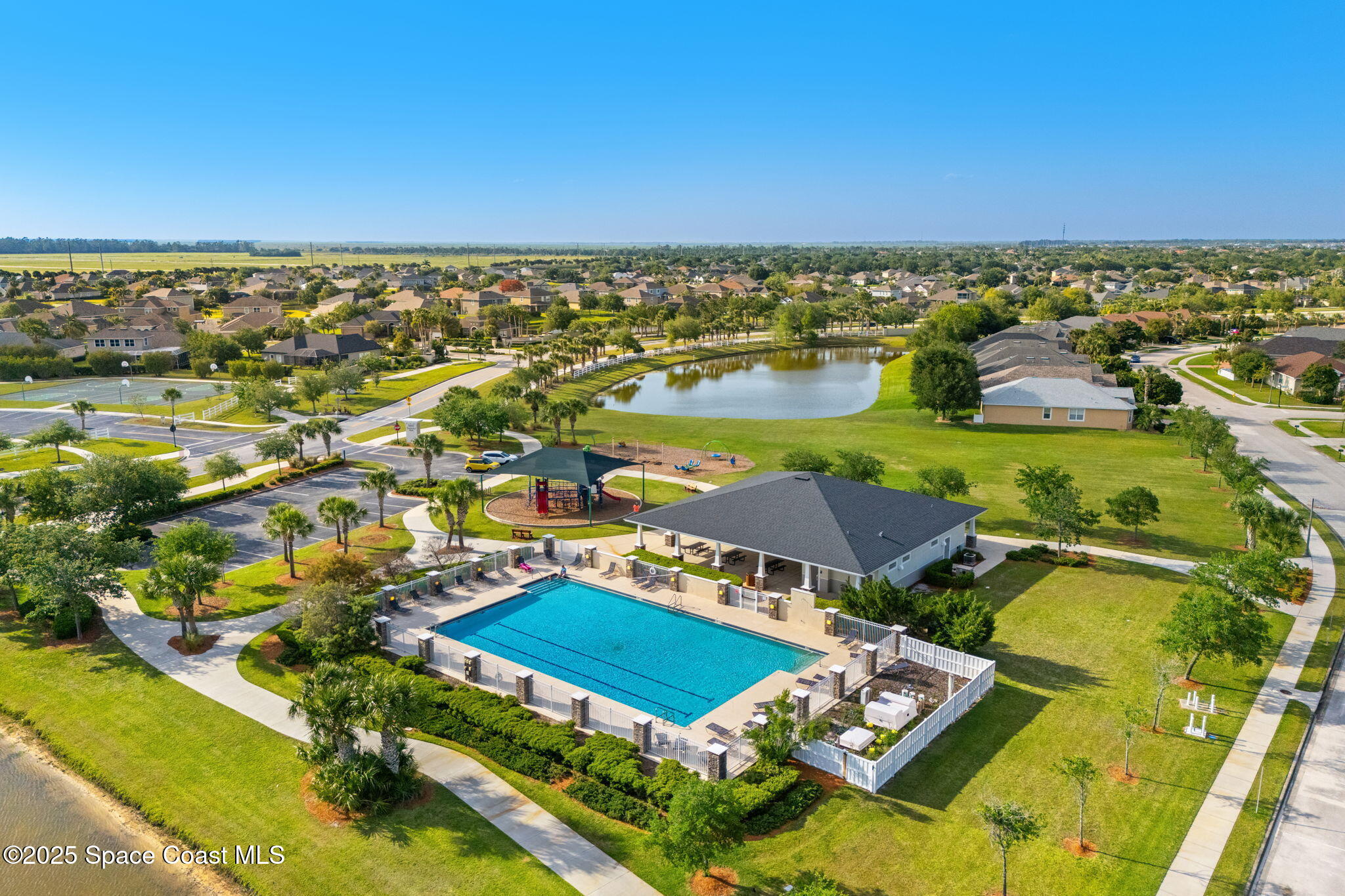 5824 Trieda Drive Melbourne, FL 32940 - Photo 44 of 45 an aerial view of residential houses with outdoor space