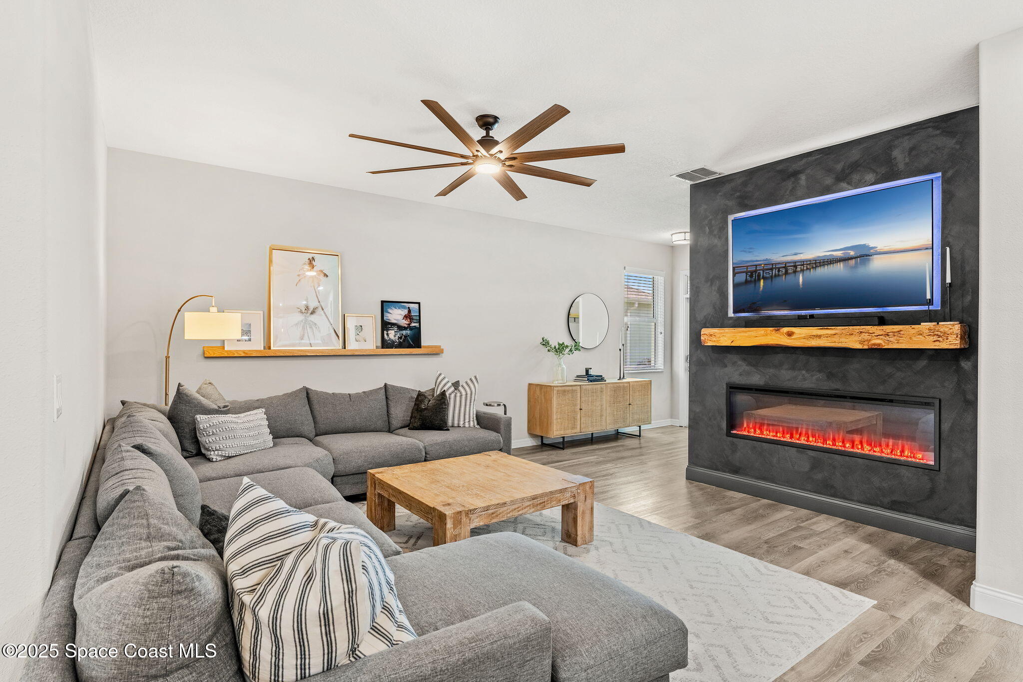 5824 Trieda Drive Melbourne, FL 32940 - Photo 9 of 45 a living room with furniture and a flat screen tv