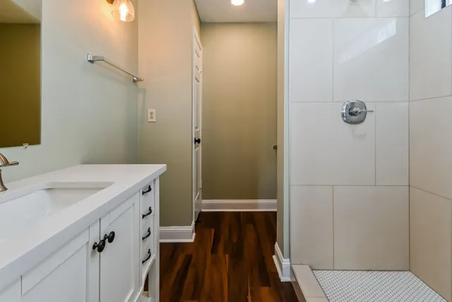 a bathroom with a sink and a mirror