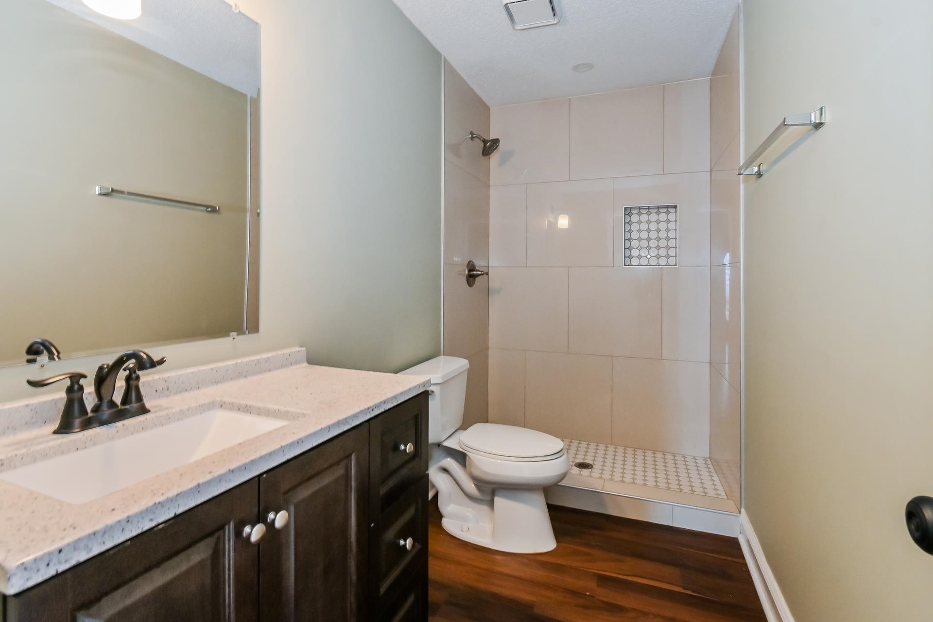 5833 South Newberry Lane Memphis, TN 38115 - Photo 14 of 16 a bathroom with a sink a toilet a shower and a mirror