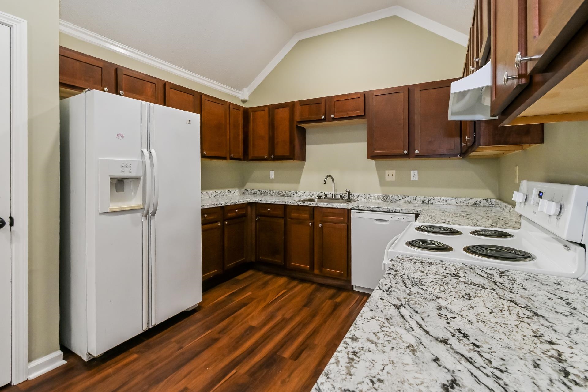 5833 South Newberry Lane Memphis, TN 38115 - Photo 8 of 16 a kitchen with a sink a stove a refrigerator and cabinets