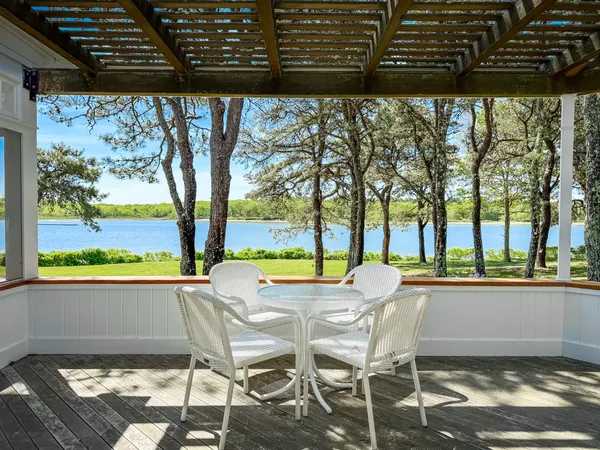 a view of a chairs and table in patio
