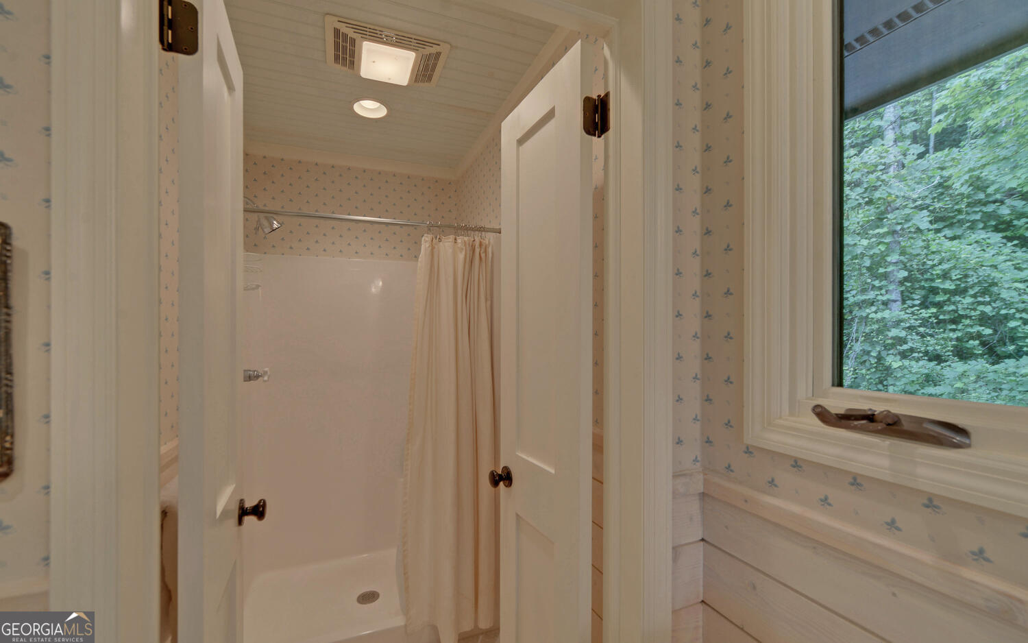 3540 Lake Rabun Road Lakemont, GA 30552 - Photo 34 of 81 a bathroom with a shower and a window
