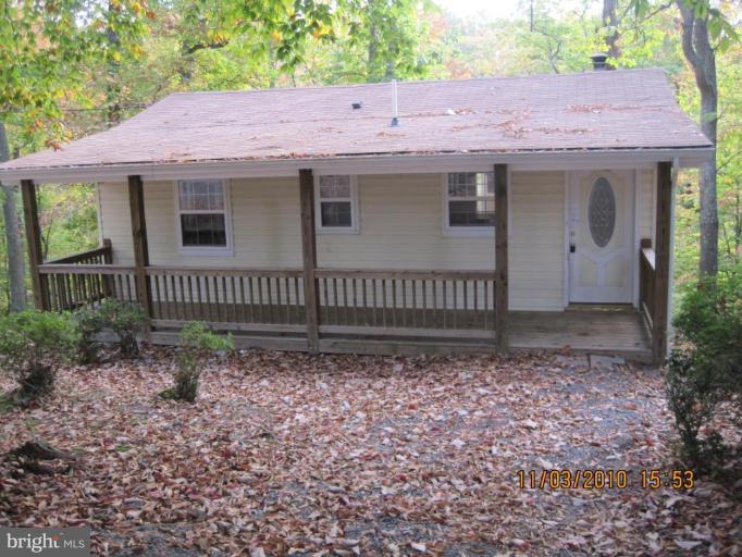 447 Buffalo Road Lusby, MD 20657 - Photo 1 of 8 a view of a house with a yard
