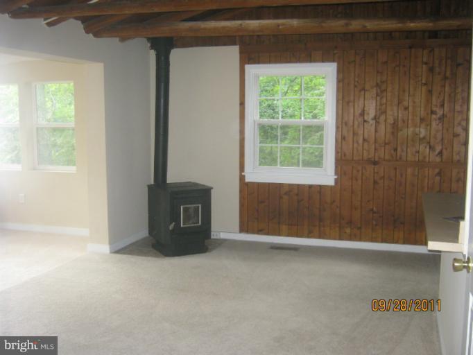 447 Buffalo Road Lusby, MD 20657 - Photo 2 of 8 a view of an empty room with a window