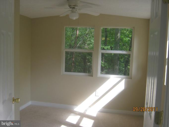 447 Buffalo Road Lusby, MD 20657 - Photo 3 of 8 a view of an empty room with a window