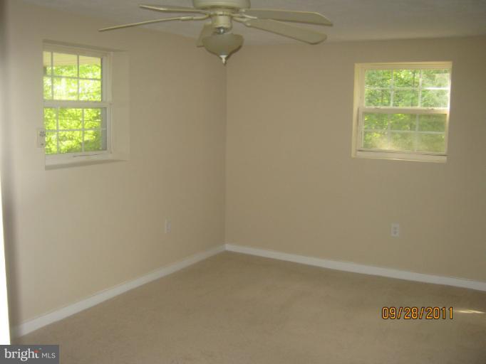 447 Buffalo Road Lusby, MD 20657 - Photo 7 of 8 an empty room with a window