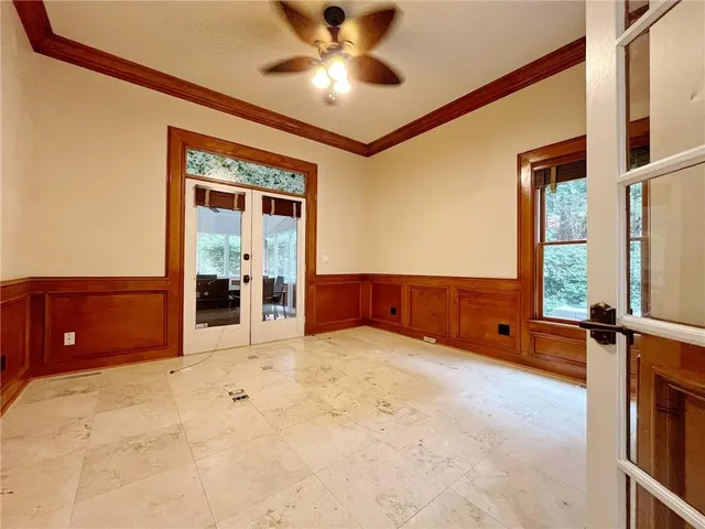 a large kitchen with kitchen island granite countertop a sink a counter top space and stainless steel appliances