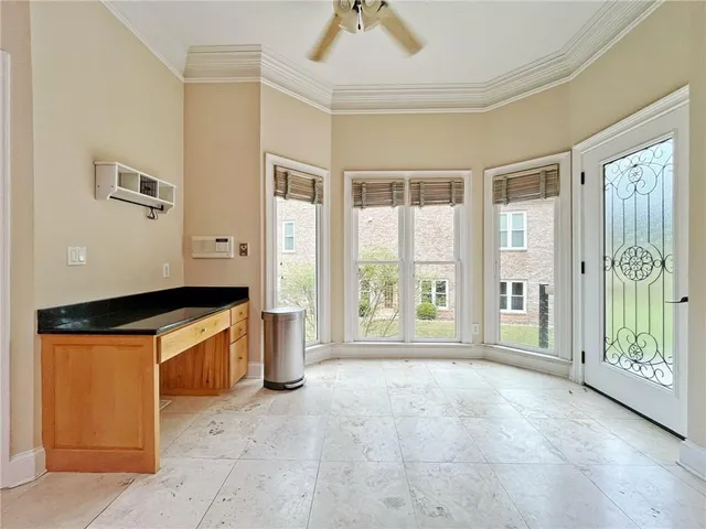 a view of a hallway with windows