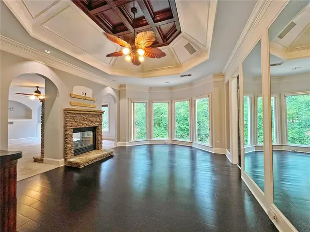 a view of a hallway to rooms