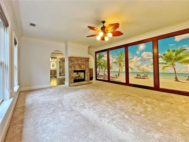 a living room with a couch and a large window