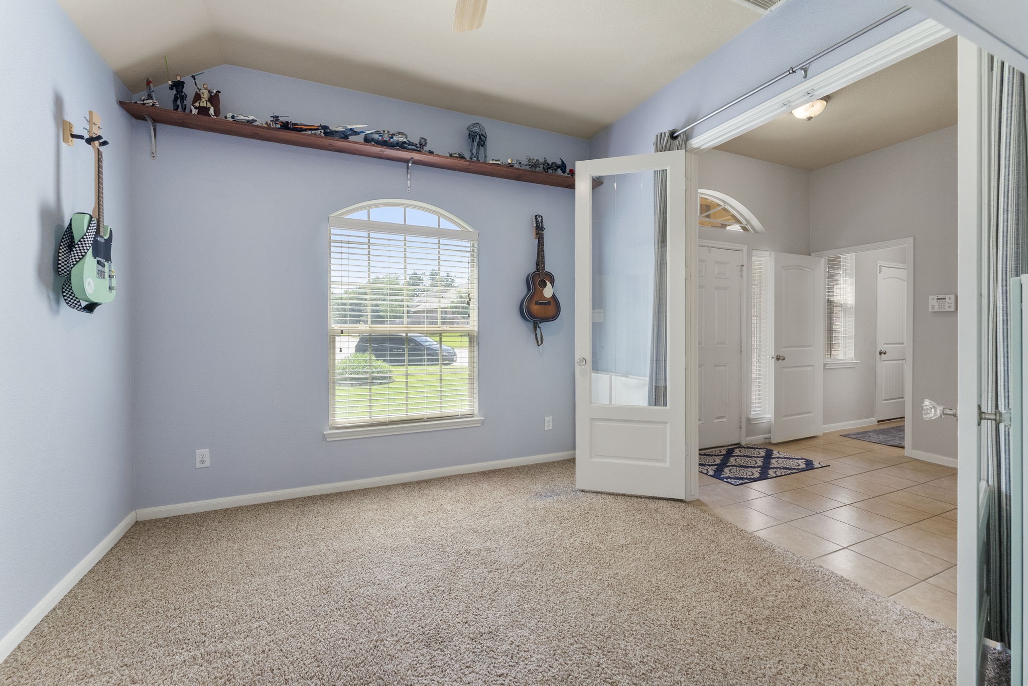 174 Maple Grove Drive Conroe, TX 77384 - Photo 5 of 26 A sunlit study featuring a front-facing window and French doors that connect seamlessly to the kitchen.