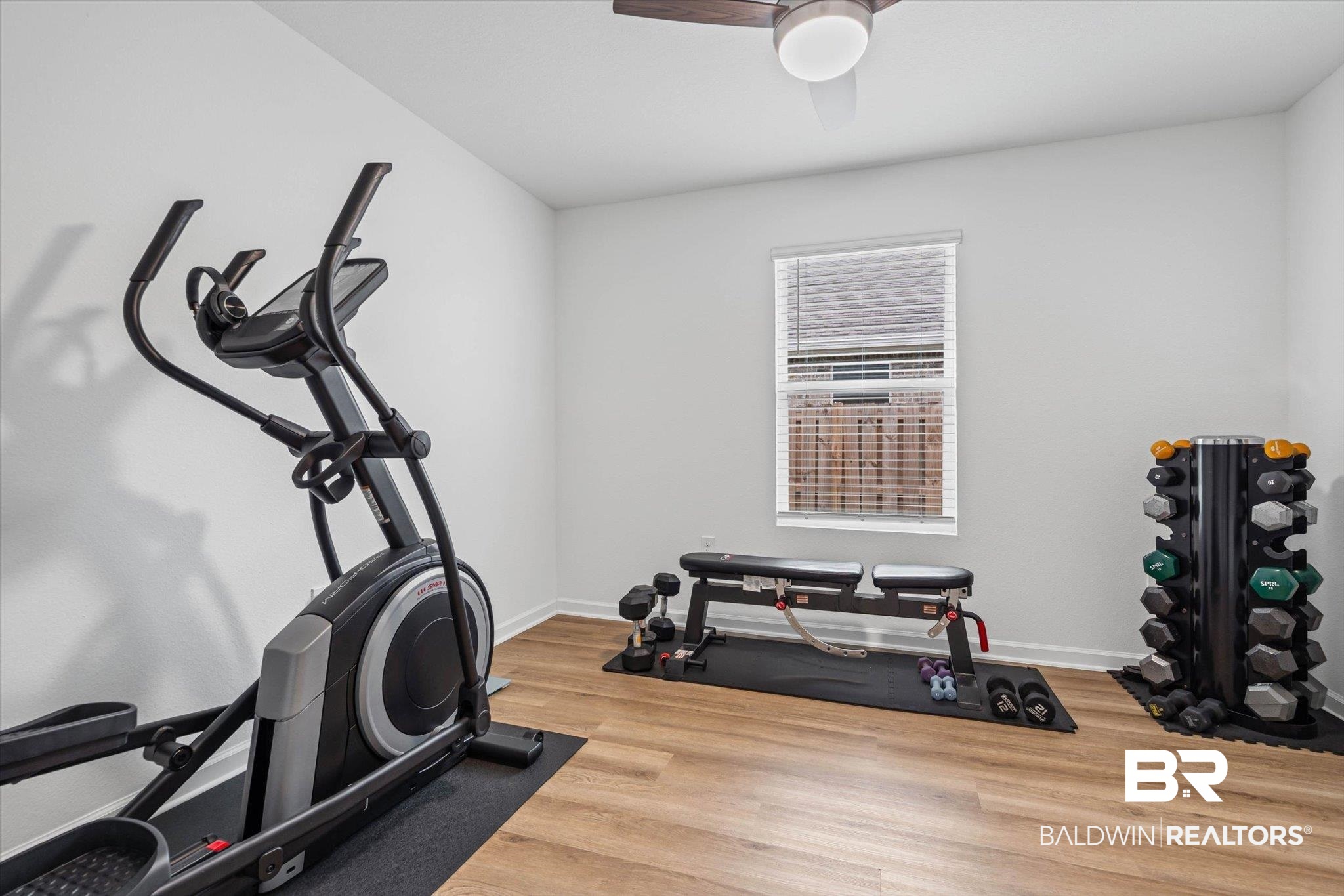 1105 Hayward Loop Foley, AL 36535 - Photo 17 of 30 Exercise area featuring light wood-style floors and ceiling fan