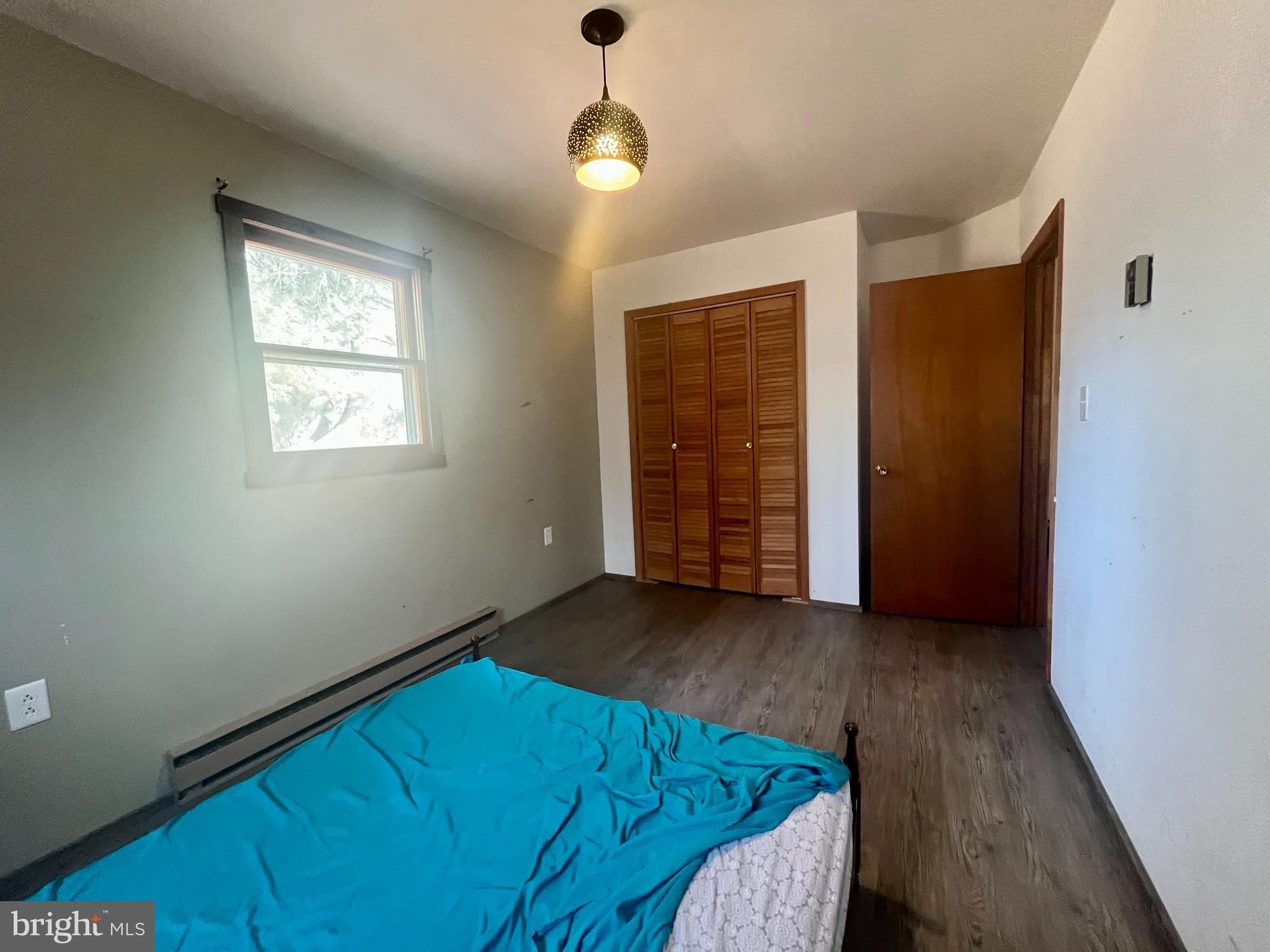 305 Rickard Place Rileyville, VA 22650 - Photo 14 of 27 wooden floor in an empty room with a window