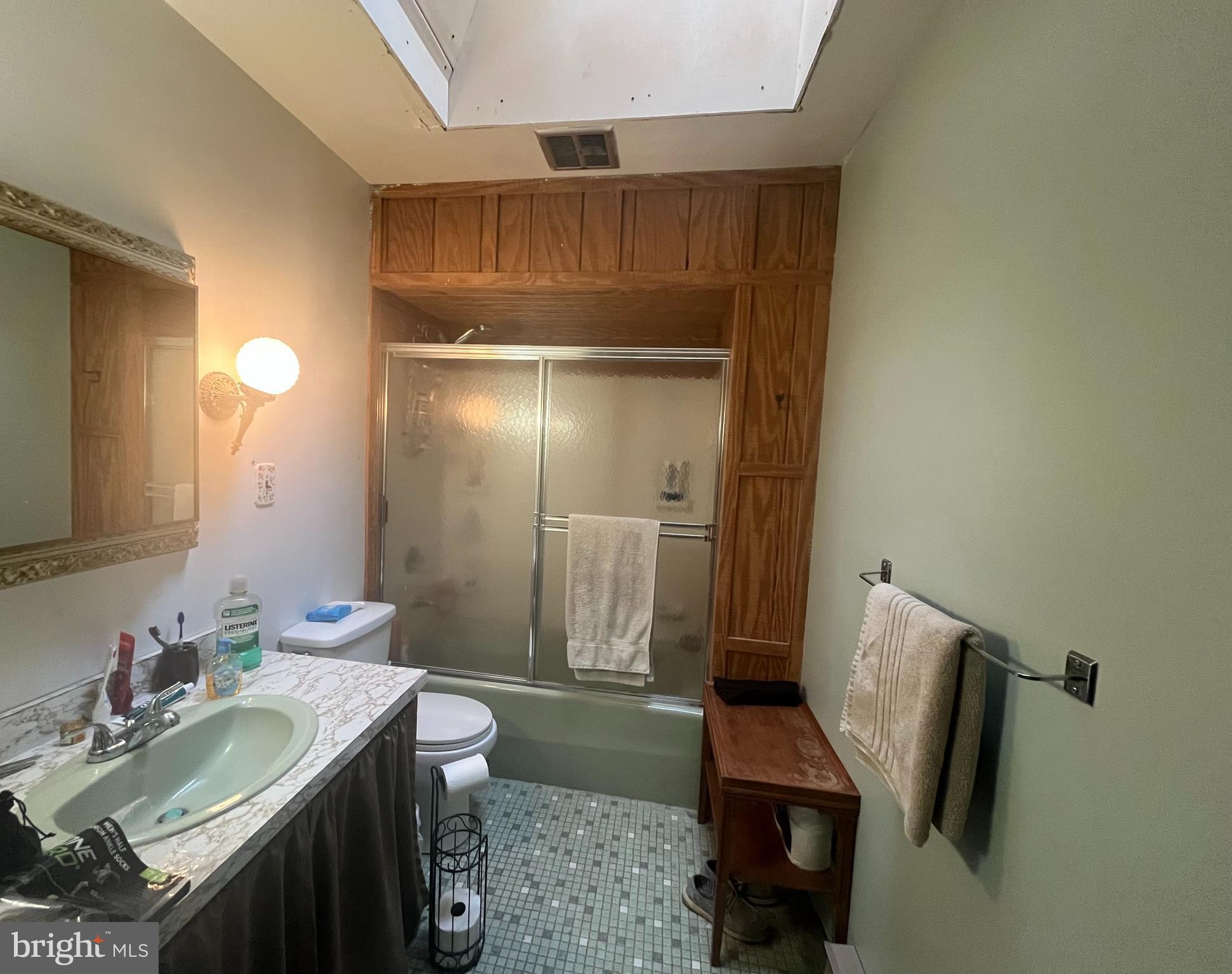 305 Rickard Place Rileyville, VA 22650 - Photo 15 of 27 a bathroom with a sink a toilet and shower