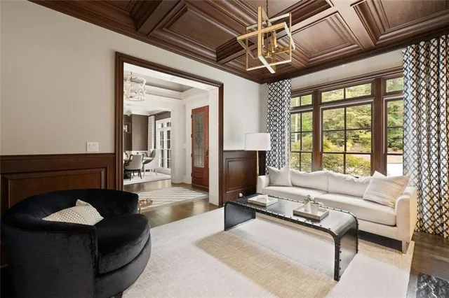 a large bedroom with a large bed a couch and a fireplace