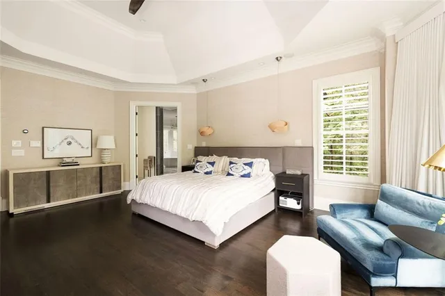 a table and chairs in a room next to a window