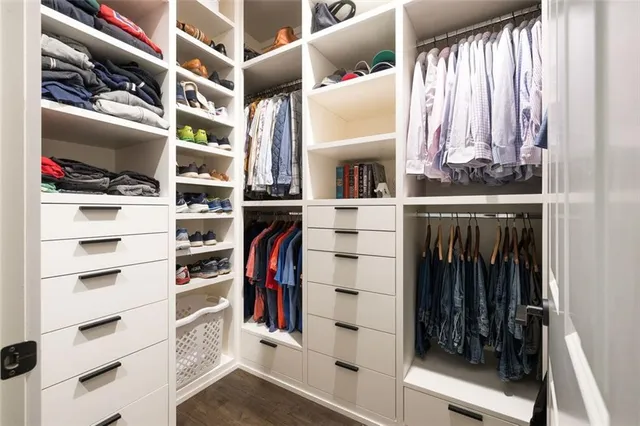 an aerial view of a house with swimming pool and lake view