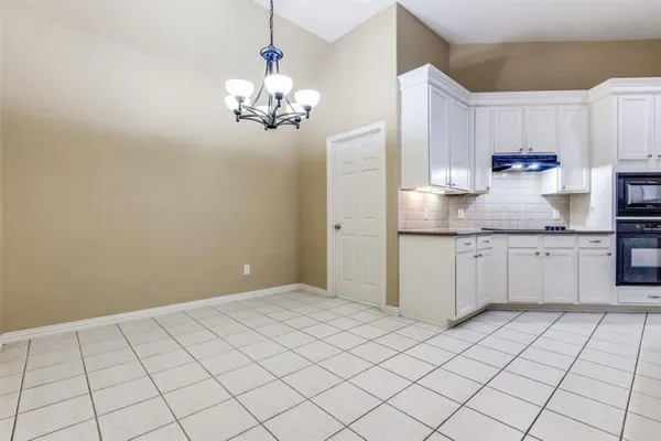 a kitchen with a sink cabinets and window