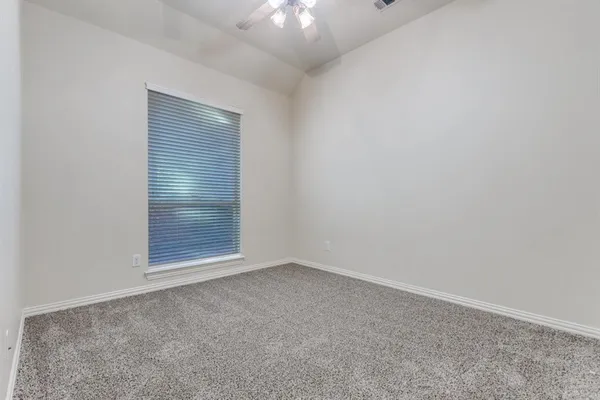 an empty room with a empty space and window