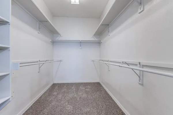 a view of a room with racks on the wall