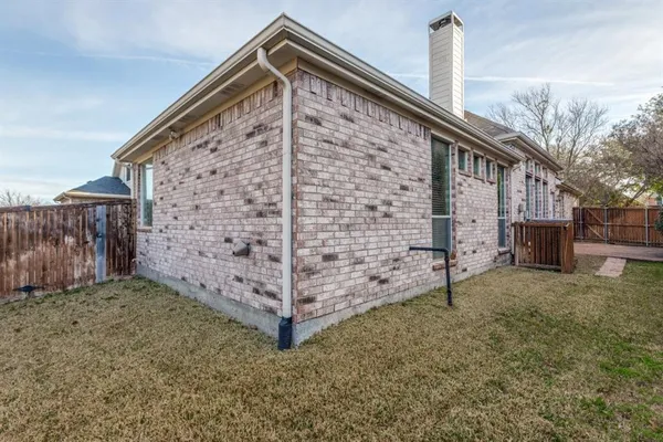 a view of a house with a small yard