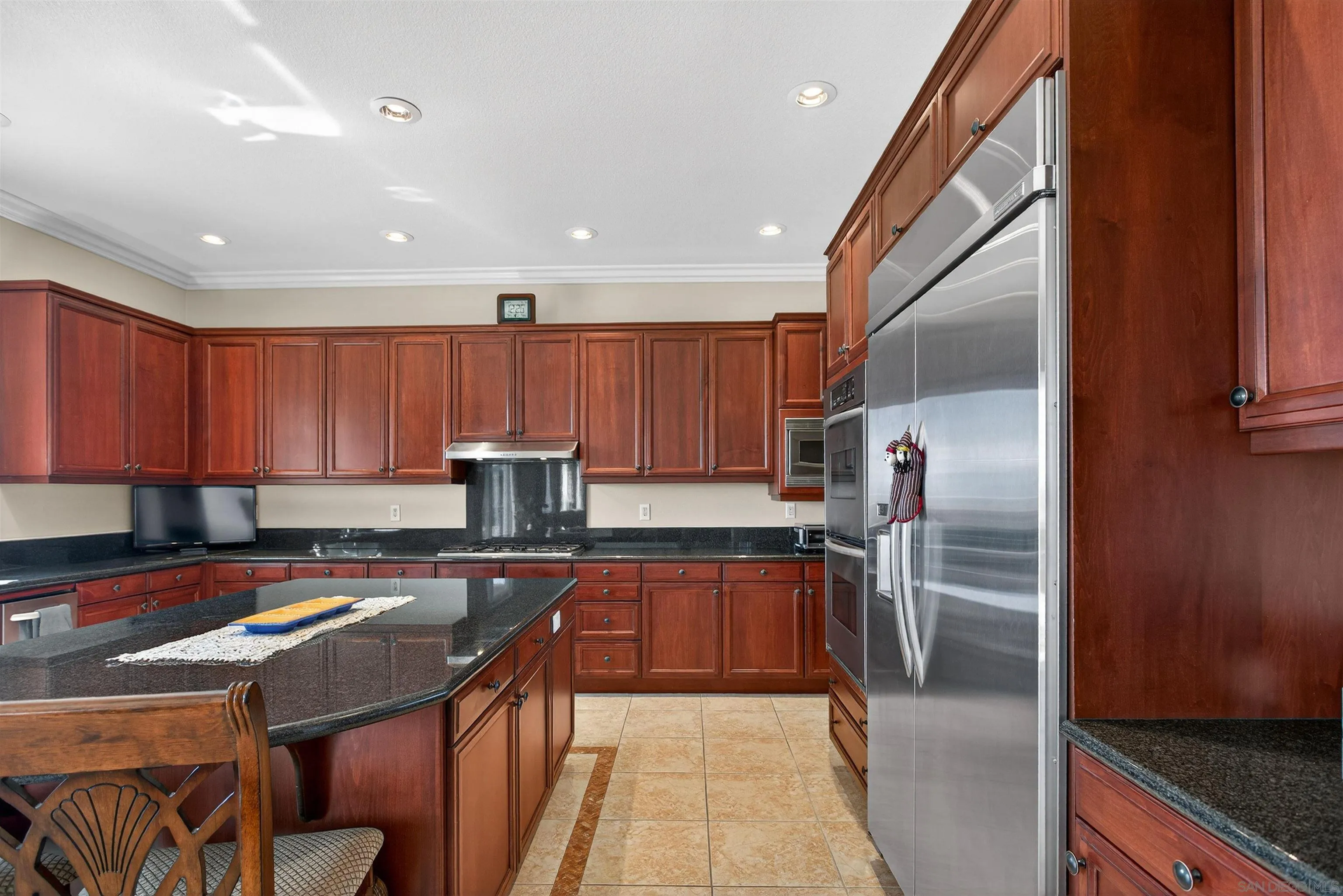 18410 Lakepointe Drive Riverside, CA 92503 - Photo 15 of 73 a kitchen with stainless steel appliances granite countertop a sink refrigerator and cabinets