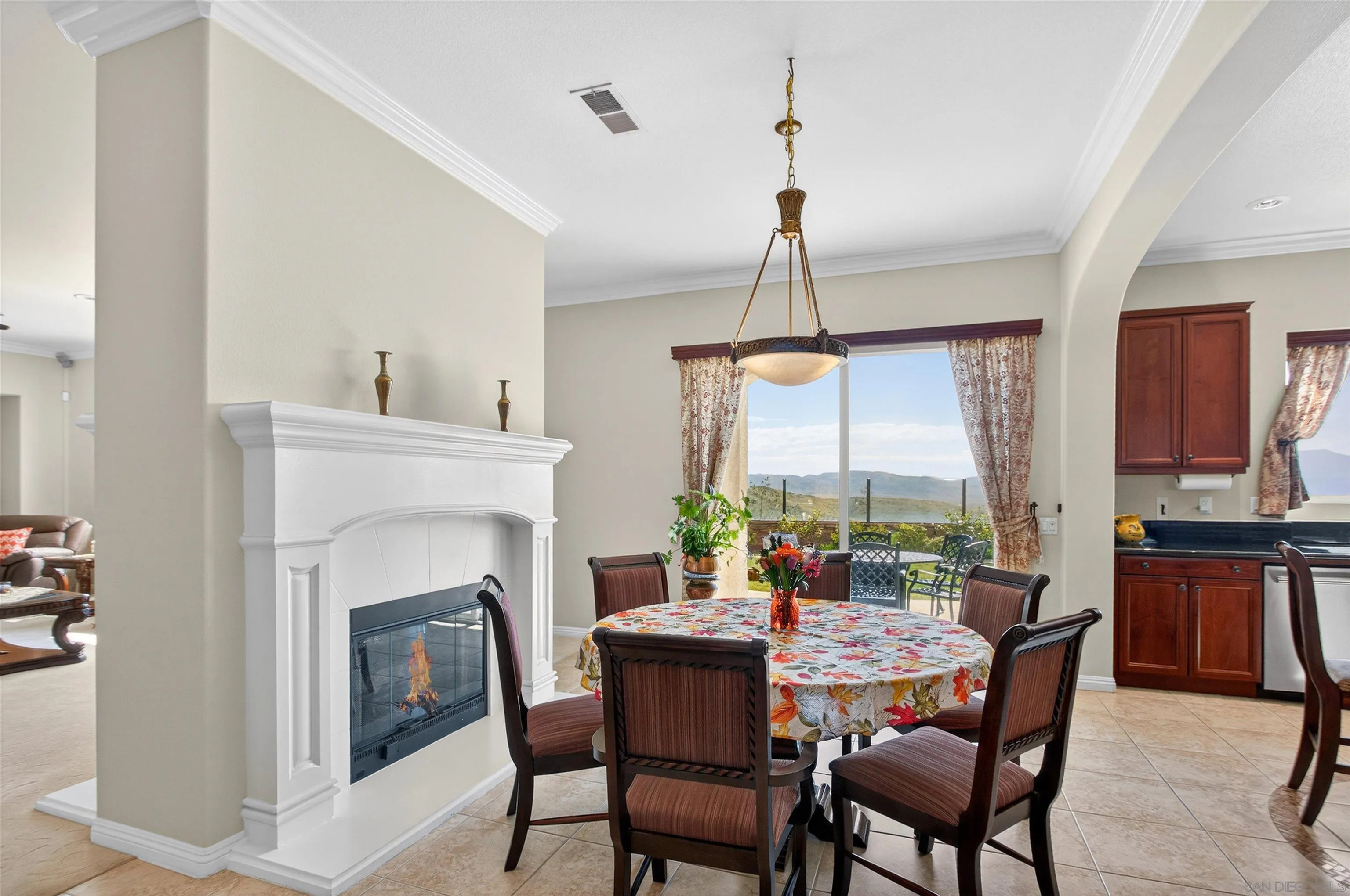 18410 Lakepointe Drive Riverside, CA 92503 - Photo 22 of 73 a dining room with furniture a chandelier and wooden floor