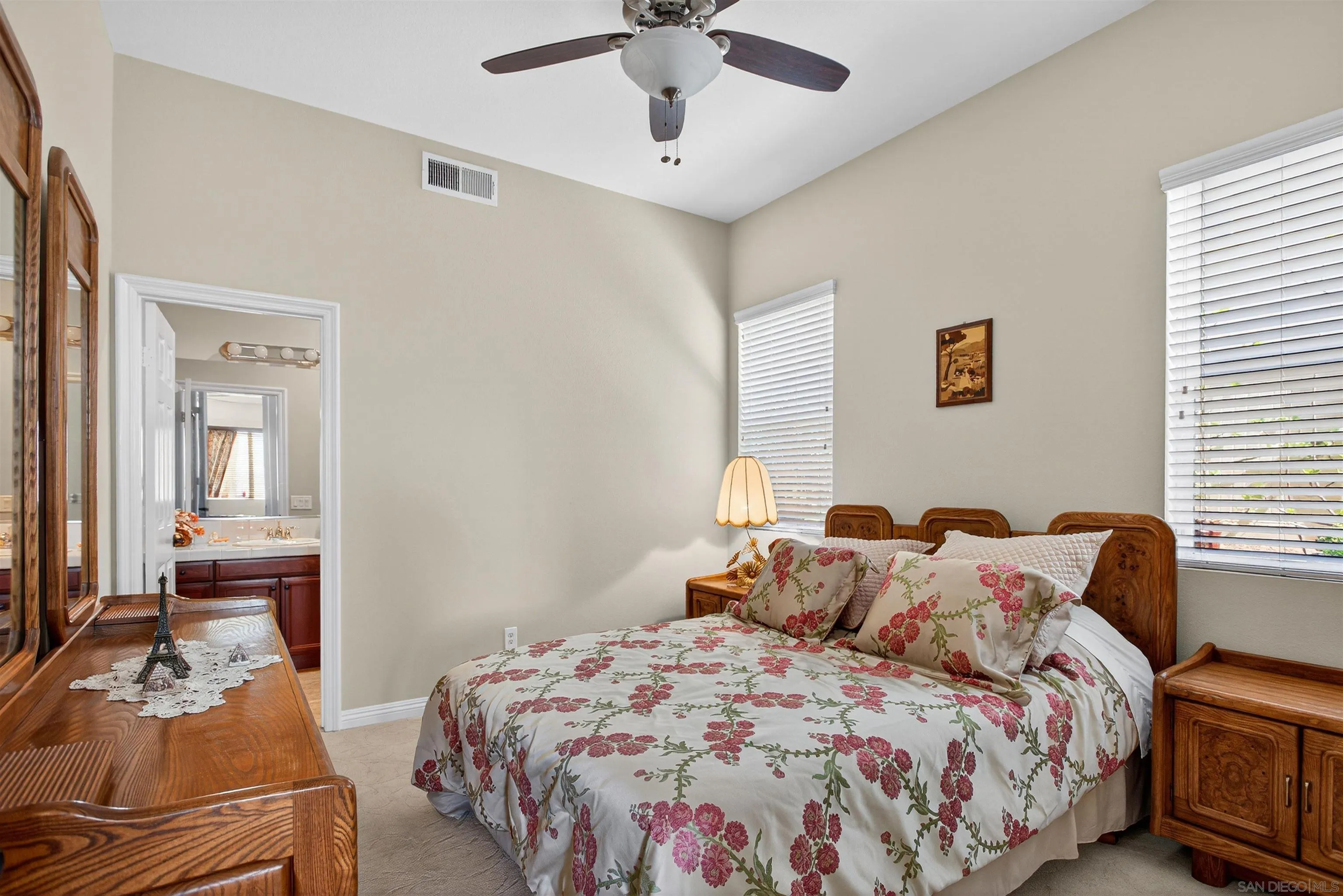 18410 Lakepointe Drive Riverside, CA 92503 - Photo 30 of 73 a bedroom with a bed and wooden floor