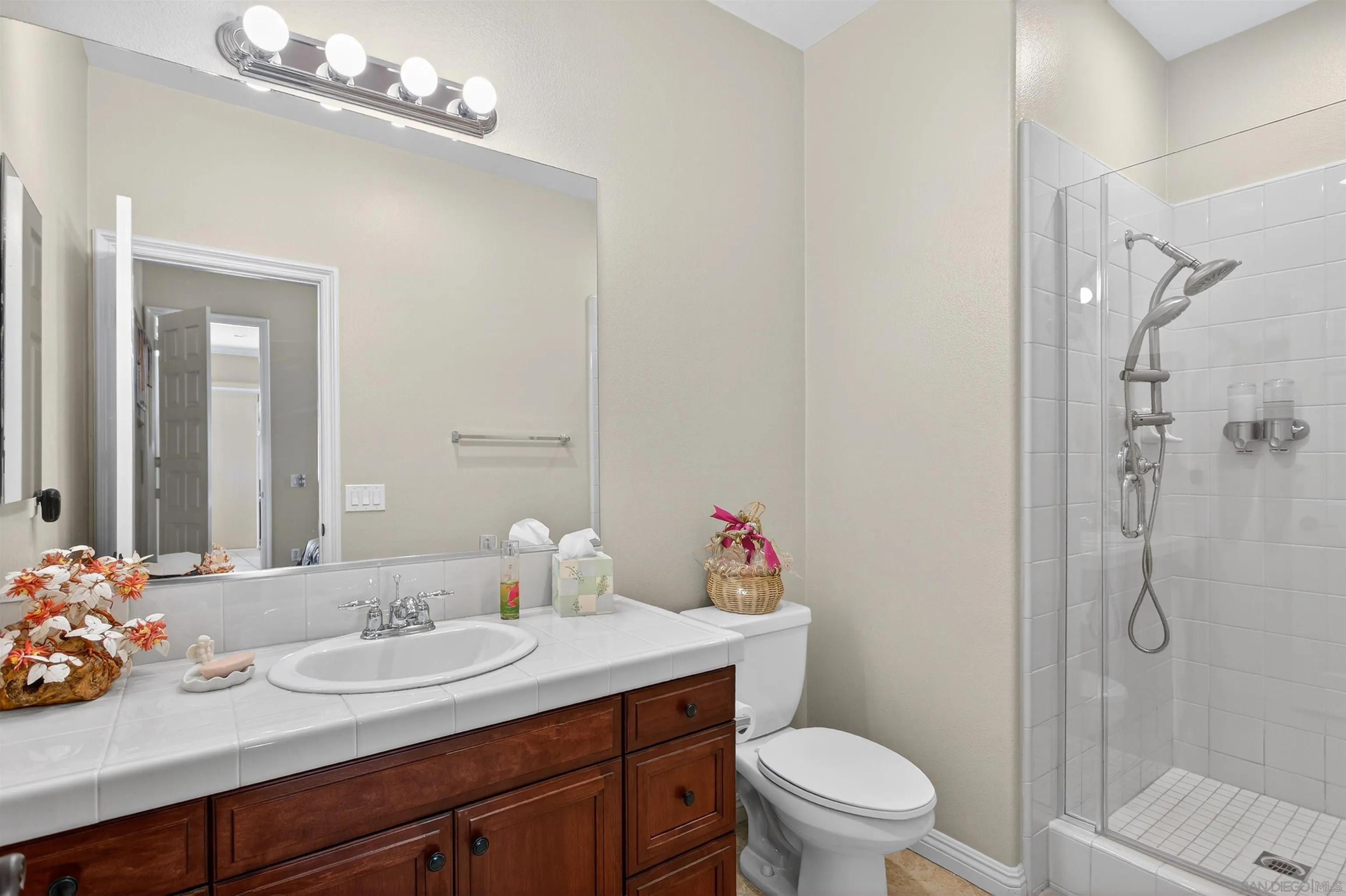 18410 Lakepointe Drive Riverside, CA 92503 - Photo 31 of 73 a bathroom with a sink toilet vanity and shower