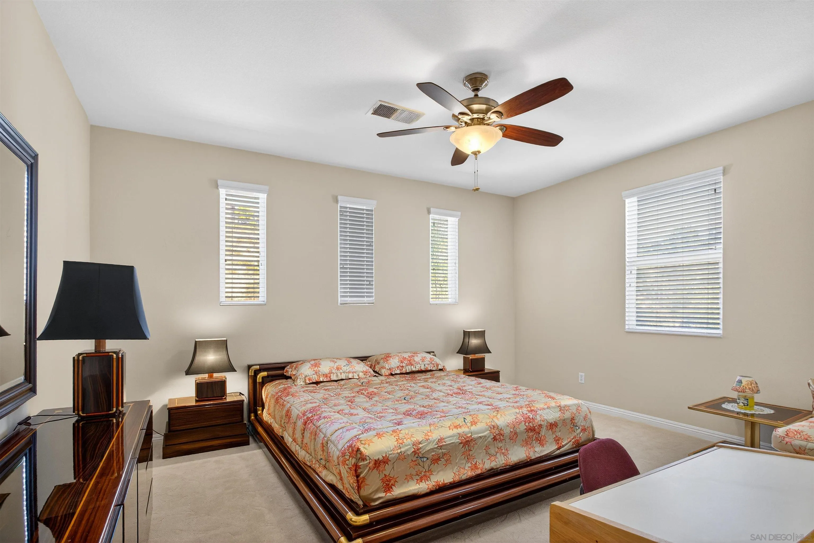 18410 Lakepointe Drive Riverside, CA 92503 - Photo 49 of 73 a bedroom with a bed and wooden floor