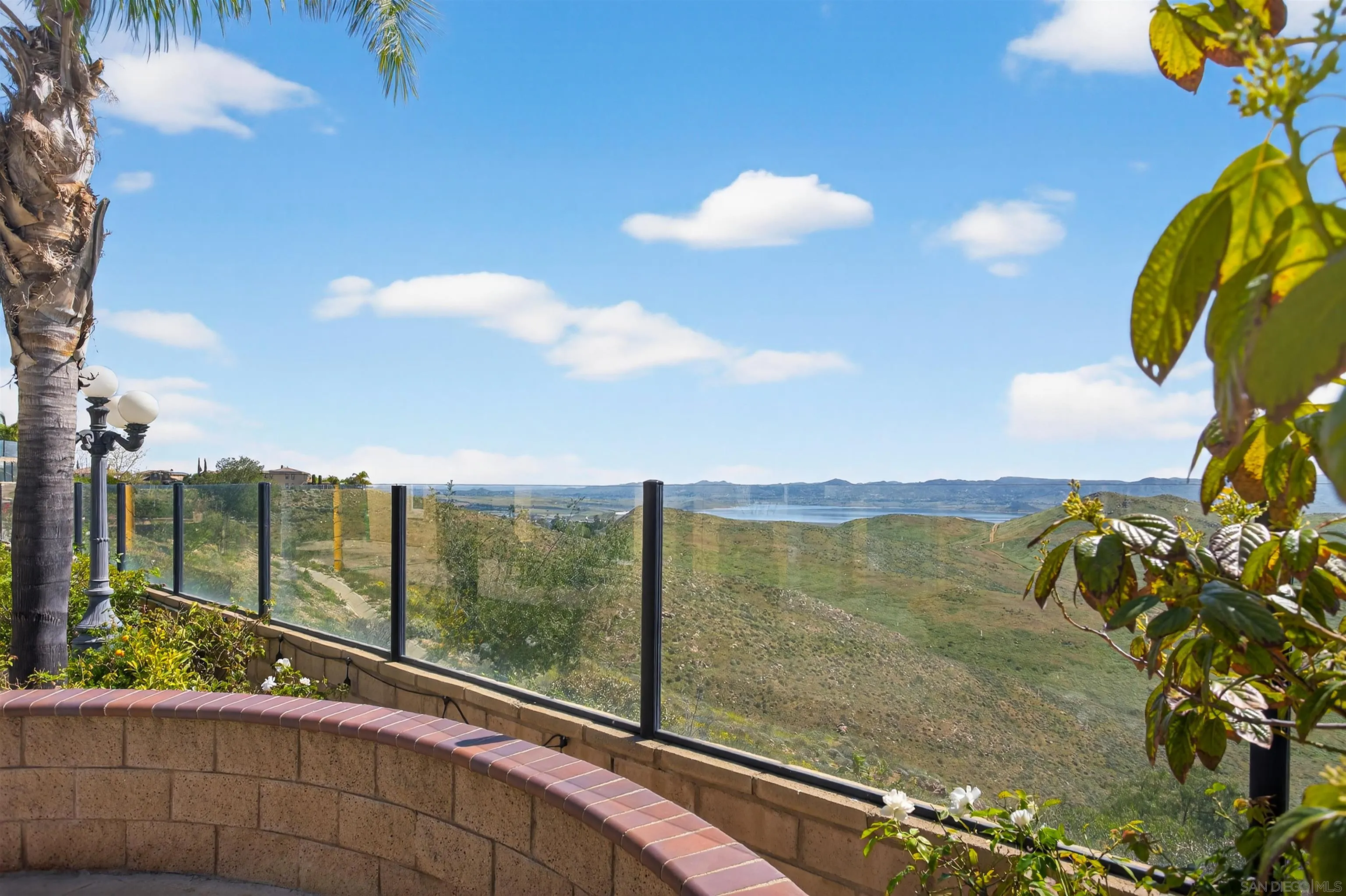 18410 Lakepointe Drive Riverside, CA 92503 - Photo 58 of 73 a view of a balcony with floor to ceiling windows and wooden fence