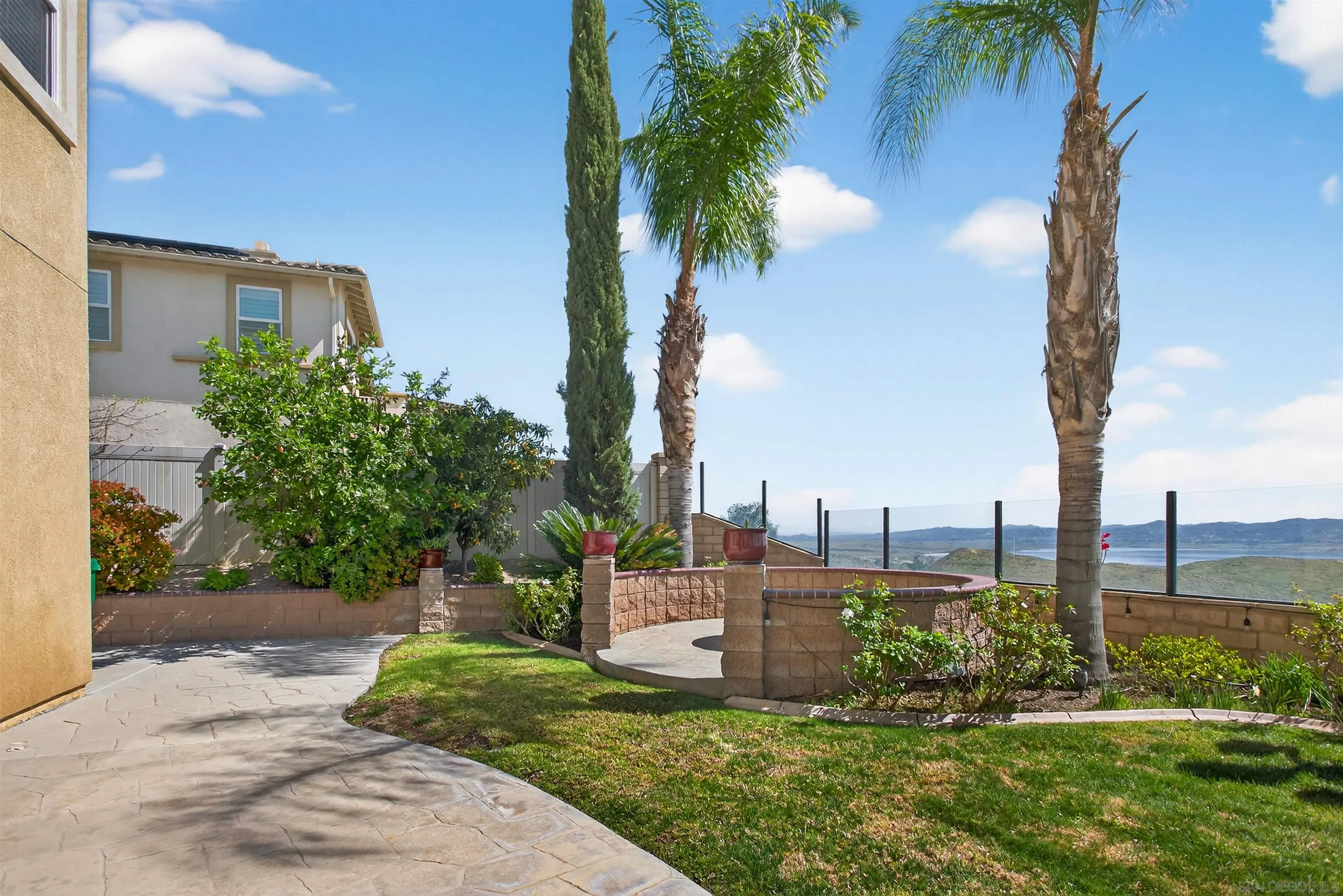 18410 Lakepointe Drive Riverside, CA 92503 - Photo 61 of 73 a view of a garden with a building in the background