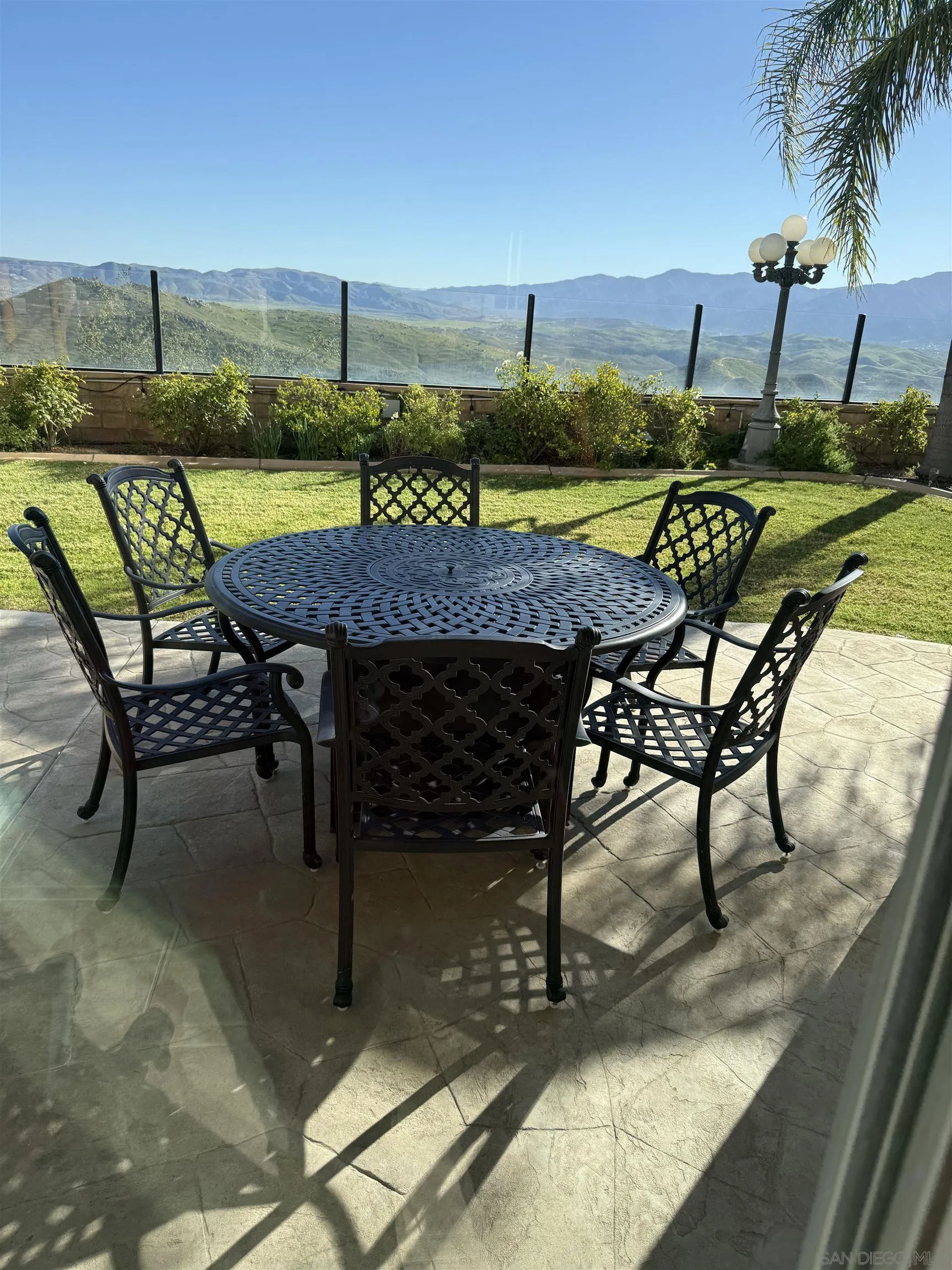 18410 Lakepointe Drive Riverside, CA 92503 - Photo 67 of 73 a view of a swimming pool with a table and chairs
